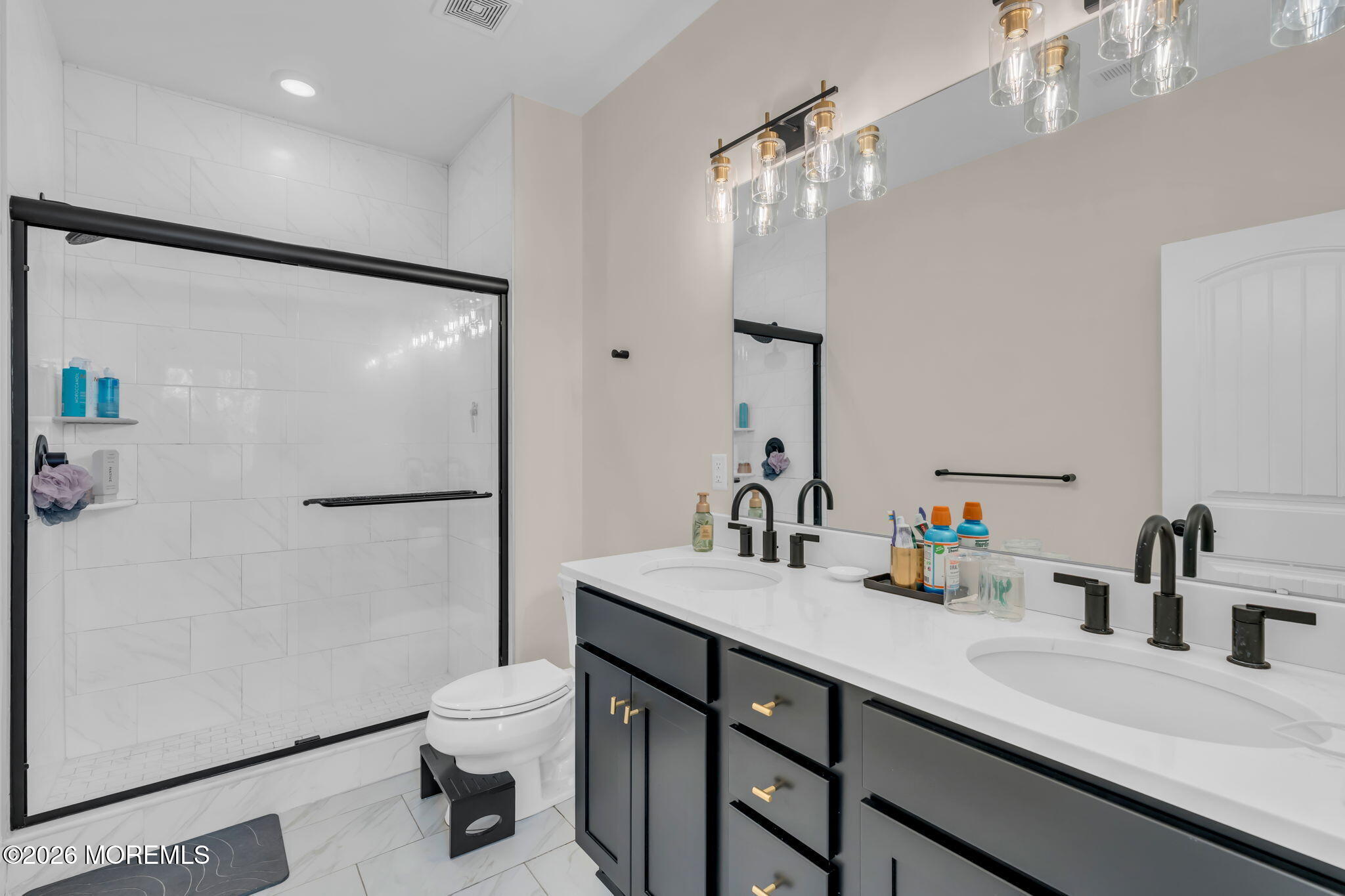 12 Raritan Boulevard Keyport, NJ 07735 - Photo 25 of 41 a bathroom with a sink a toilet a mirror and shower