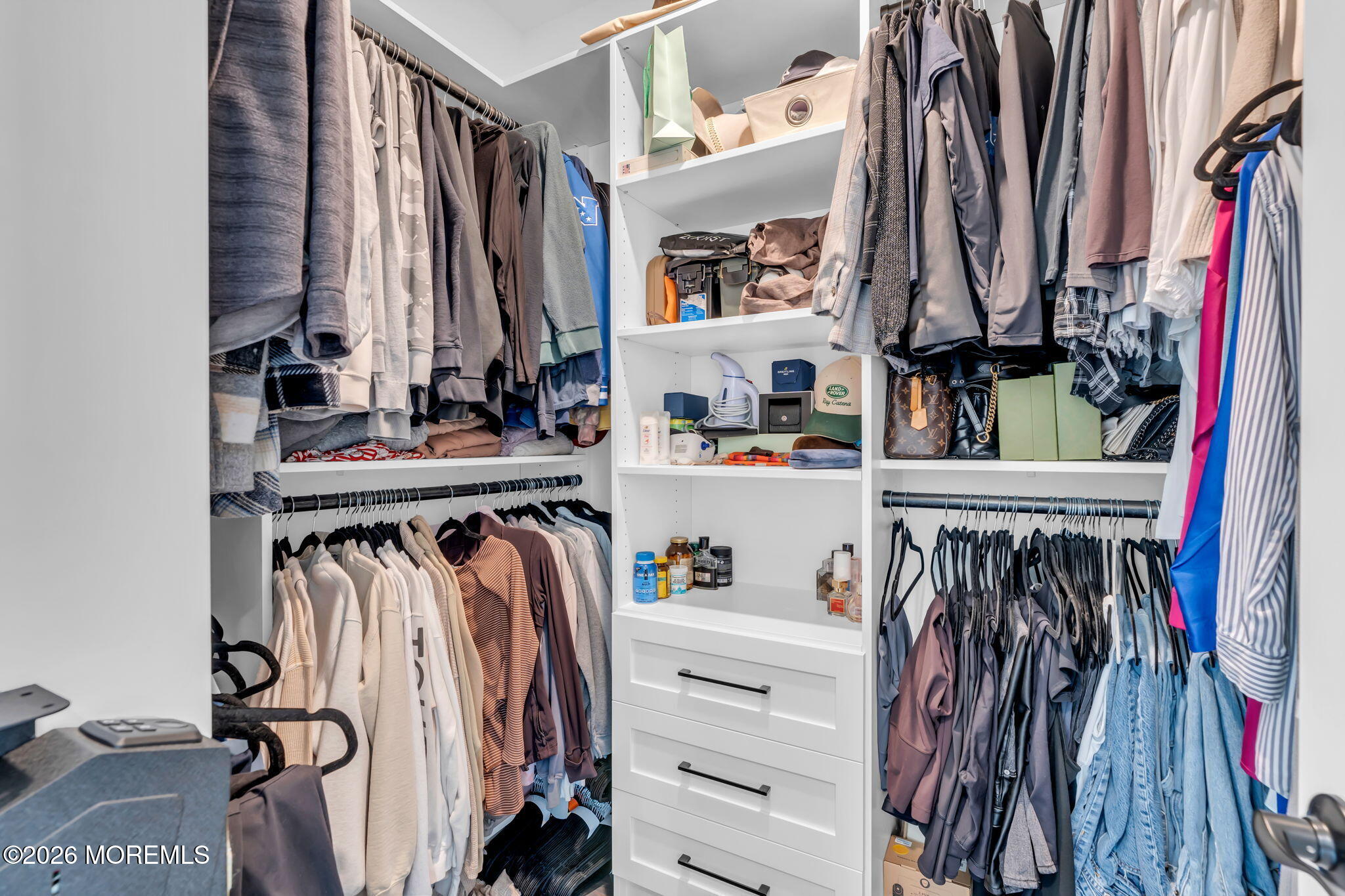 12 Raritan Boulevard Keyport, NJ 07735 - Photo 26 of 41 a view of walk in closet with clothes and shoes