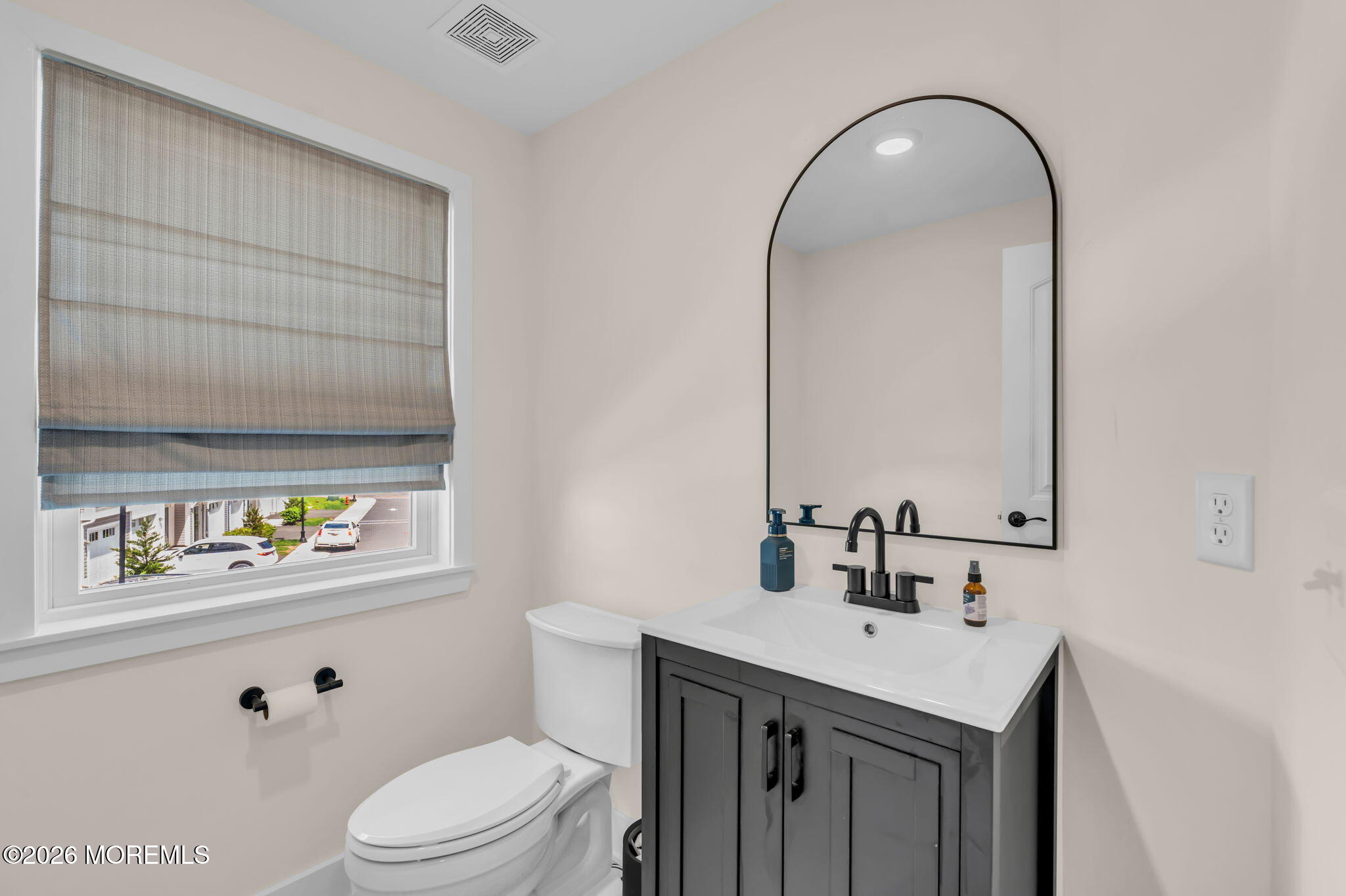 12 Raritan Boulevard Keyport, NJ 07735 - Photo 33 of 41 a bathroom with a sink a toilet and vanity