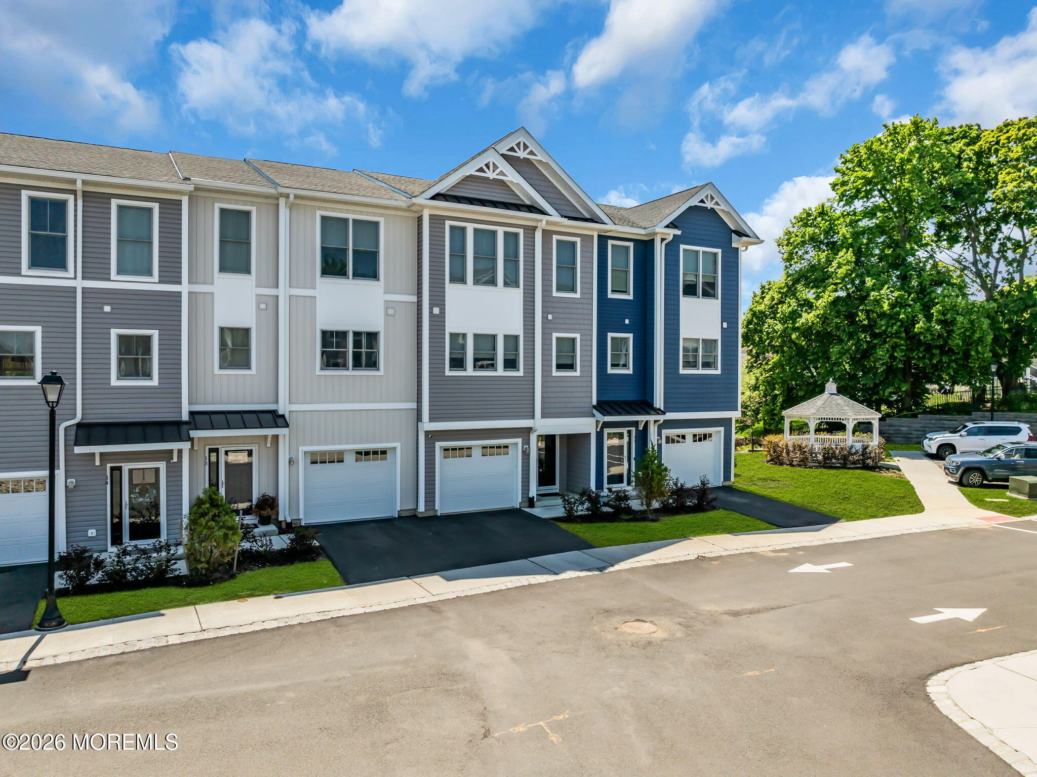 12 Raritan Boulevard Keyport, NJ 07735 - Photo 35 of 41 a front view of a residential apartment building with a yard