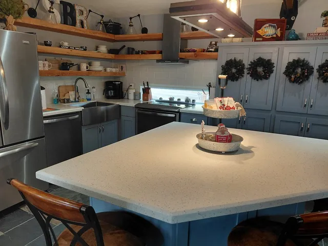 a kitchen with a table and chairs in it