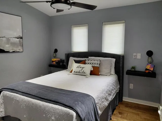 a bedroom with a bed and window