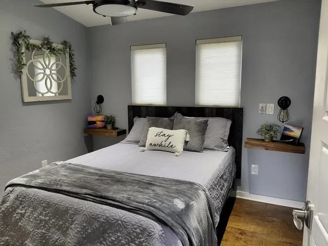 a bathroom with a double vanity sink and a mirror