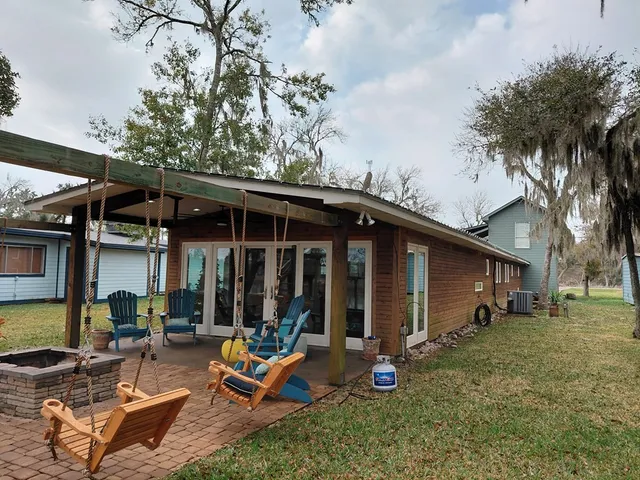 a view of a backyard with a patio