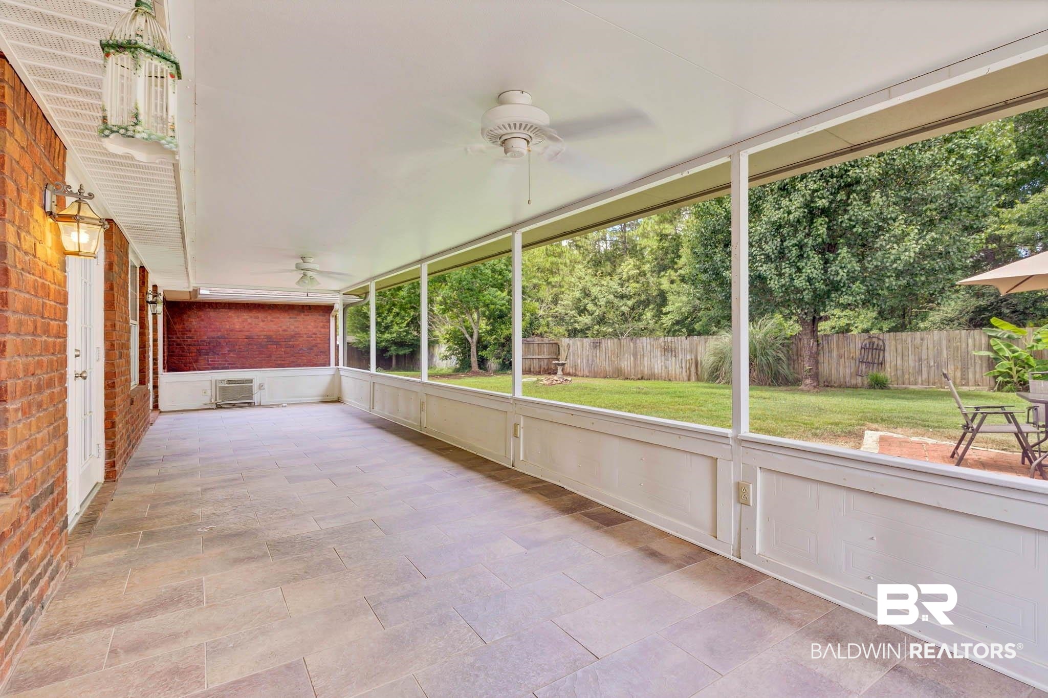 329 Collinwood Loop Foley, AL 36535 - Photo 26 of 35 Unfurnished sunroom with a ceiling fan and plenty of natural light