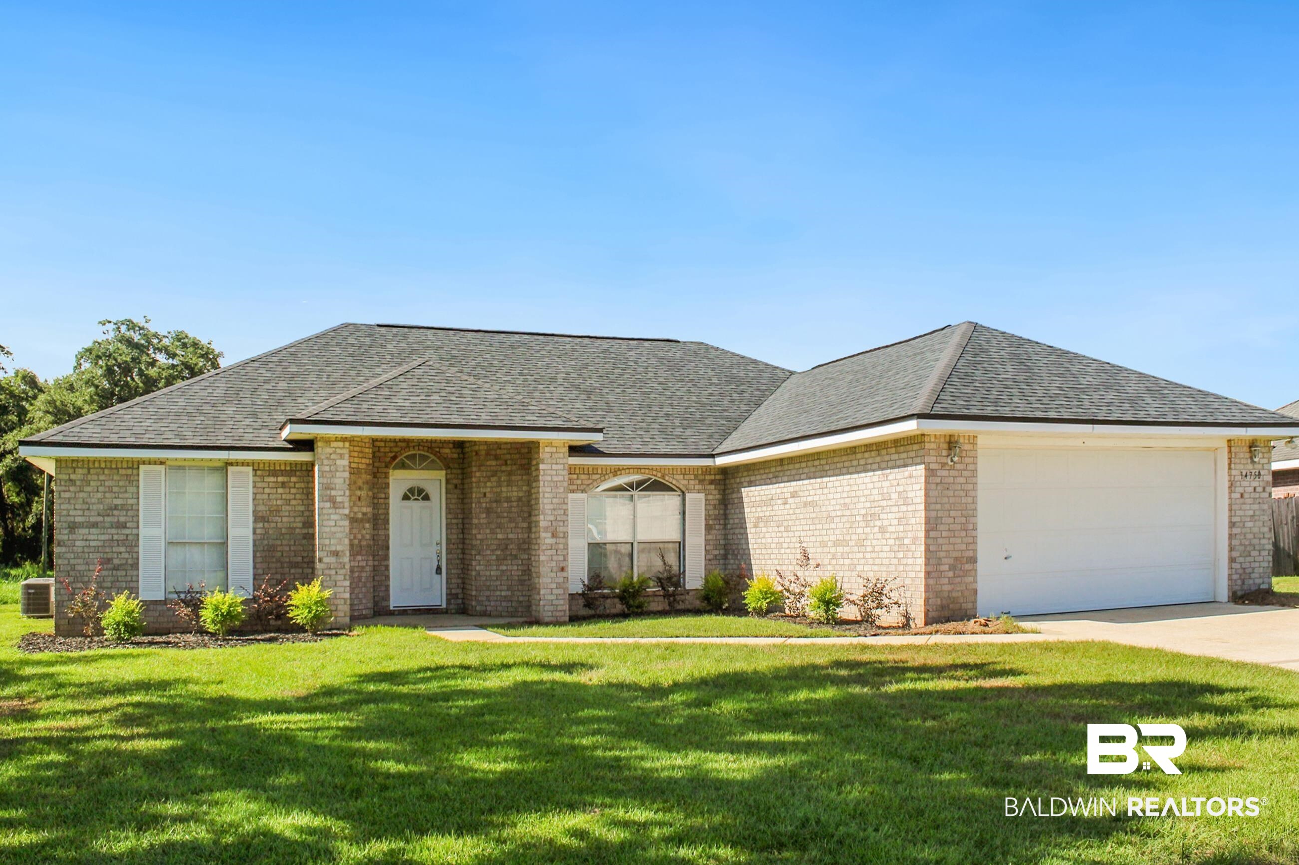 14750 Pawnee Court Foley, AL 36535 - Photo 4 of 34 Single story home with an attached garage, a front yard, concrete driveway, brick siding, and roof with shingles