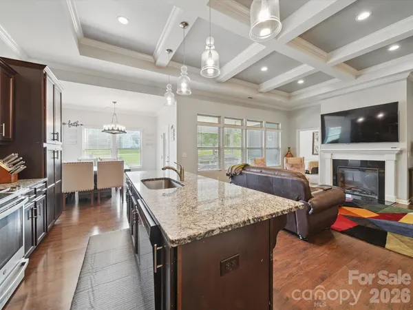 a living room with fireplace furniture and a flat screen tv
