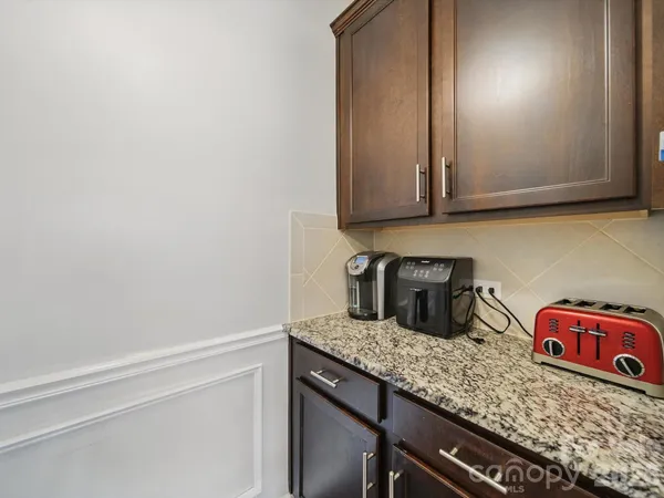 a kitchen with granite countertop cabinets and a sink