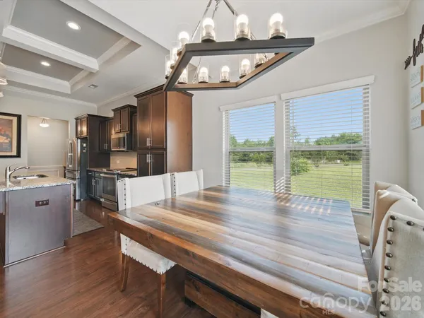 a open kitchen with stainless steel appliances granite countertop a stove and refrigerator