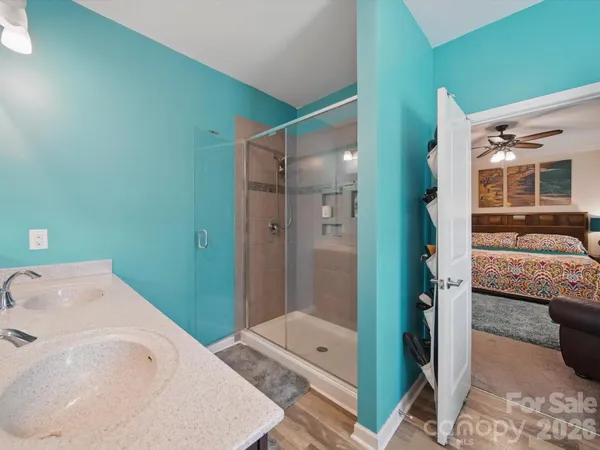 a bathroom with a tub and shower