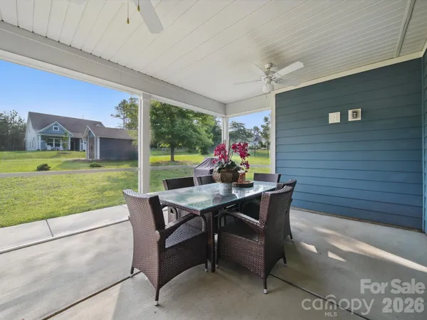 a view of a patio with a yard