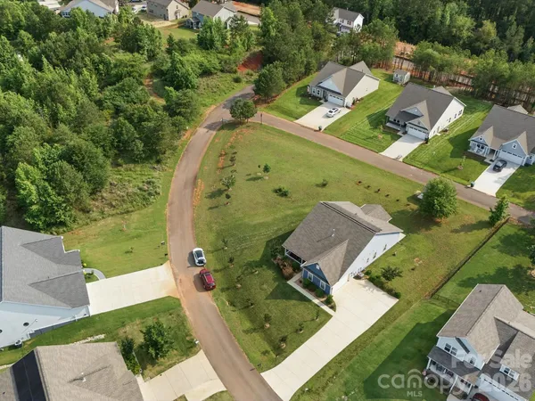 an aerial view of a house with a garden