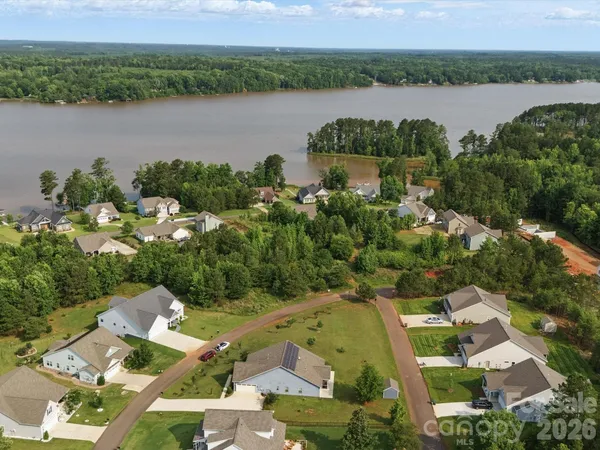 an aerial view of a city and lake view
