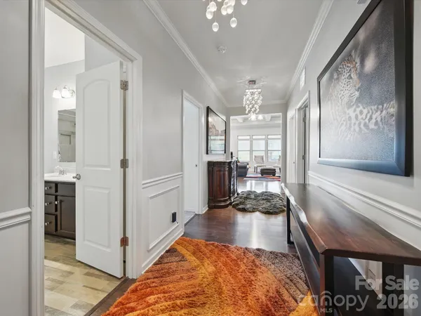 a view of a hallway view with living room and dining room
