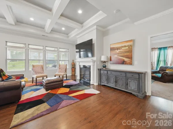 a living room with furniture flat screen tv and a fireplace