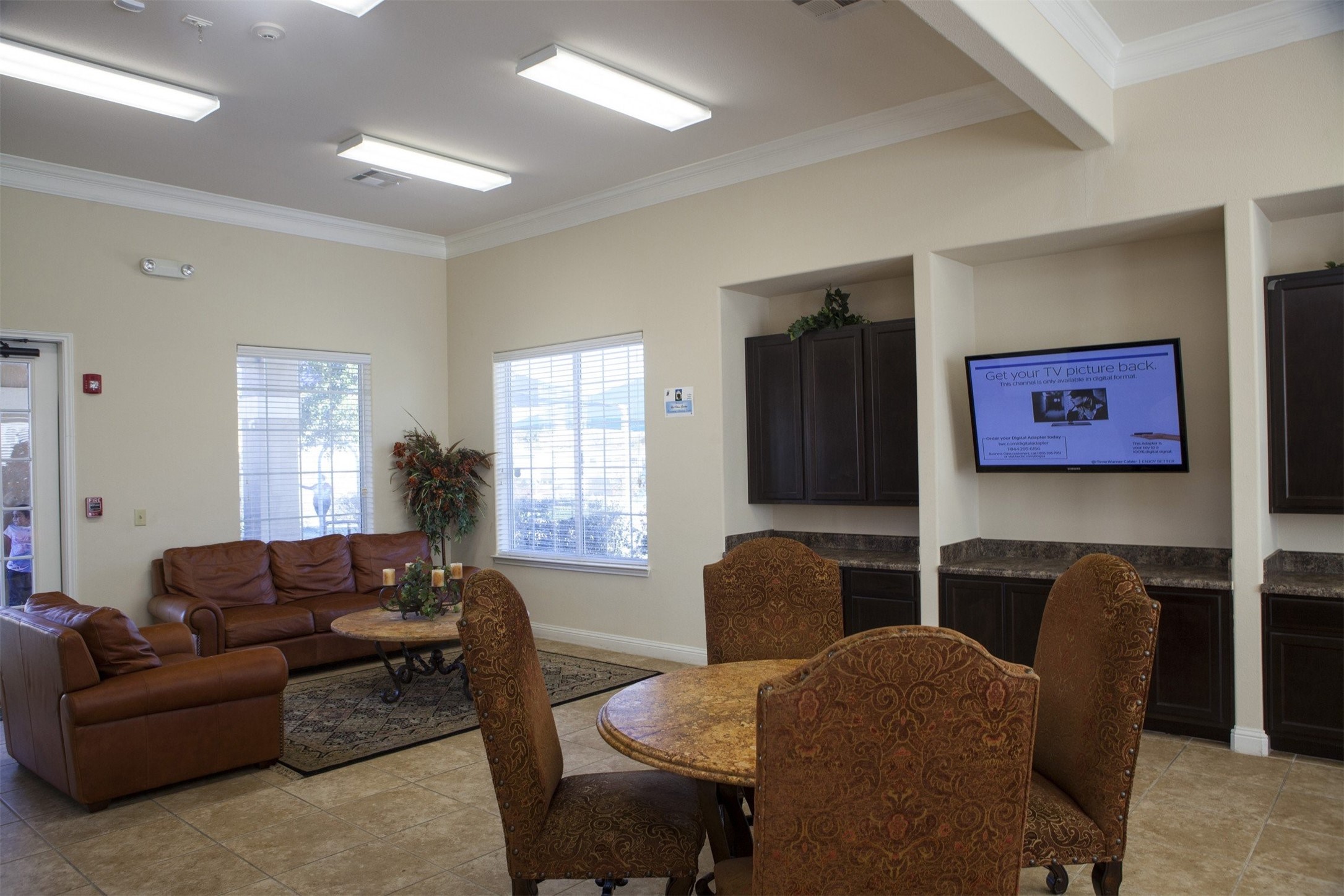 1215 Castroville Road San Antonio, TX 78237 - Photo 11 of 14 a living room with furniture window and a flat screen tv