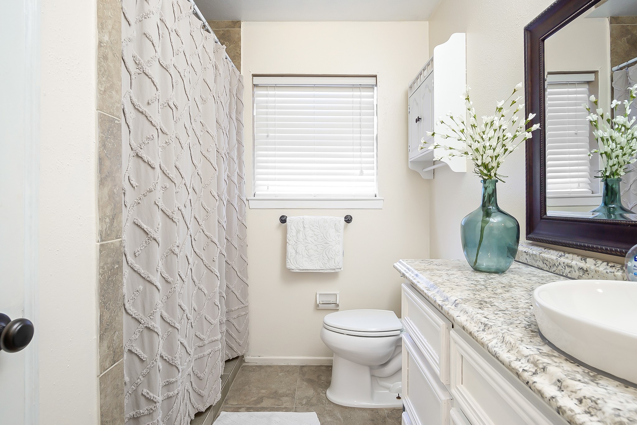706 Yale Lane Deer Park, TX 77536 - Photo 26 of 43 a bathroom with a granite countertop sink a toilet and a mirror