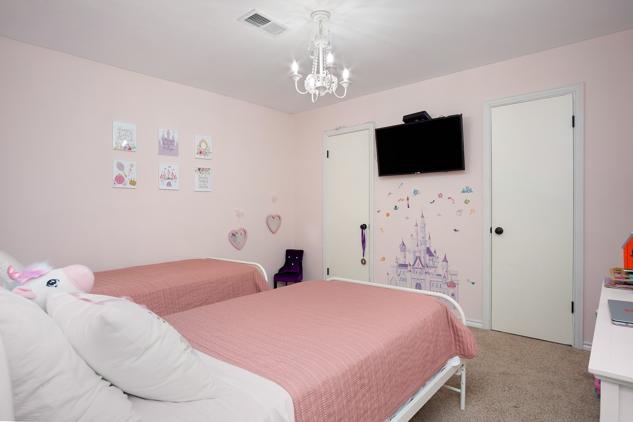 706 Yale Lane Deer Park, TX 77536 - Photo 31 of 43 a bedroom with a bed and a flat tv screen on dresser