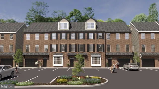 a front view of a house with yard and parking