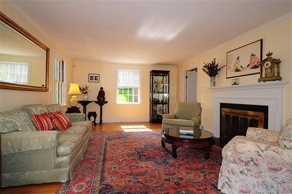 31 Radcliffe Road Wellesley, MA 02482 - Photo 3 of 17 a living room with furniture and a fireplace