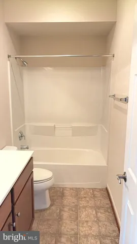 a bathroom with a sink a toilet and a bathtub