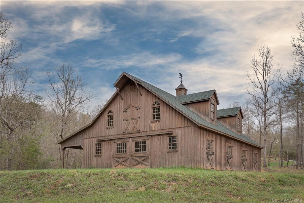 0 Sloping Meadow Mill Spring, NC 28756 - Photo 2 of 26 a view of a house with a yard