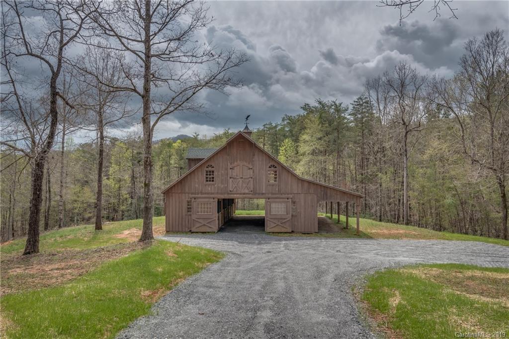 0 Sloping Meadow Mill Spring, NC 28756 - Photo 11 of 26 a view of a house with backyard and a tree