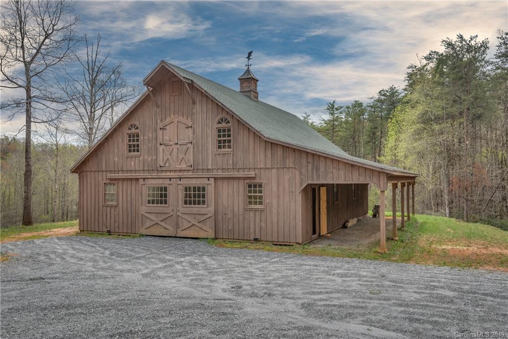 0 Sloping Meadow Mill Spring, NC 28756 - Photo 12 of 26 a view of a house with a yard