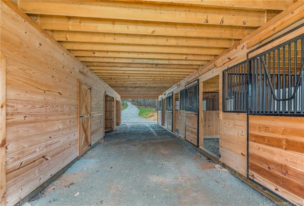 0 Sloping Meadow Mill Spring, NC 28756 - Photo 16 of 26 a view of a porch with wooden walls