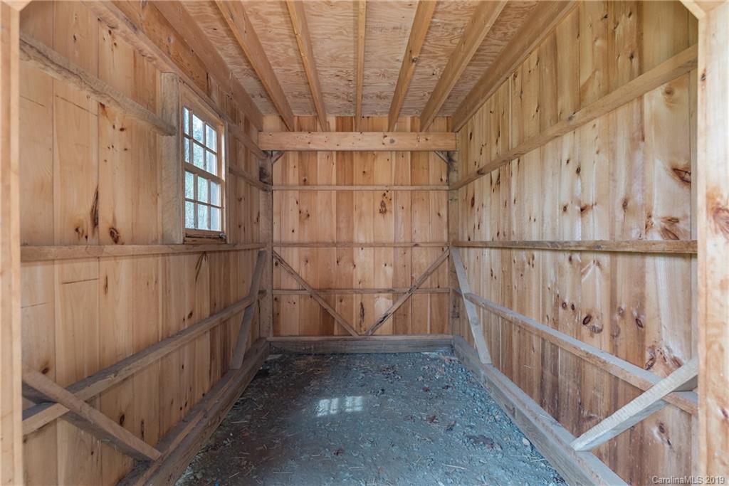 0 Sloping Meadow Mill Spring, NC 28756 - Photo 17 of 26 a view of an empty room with wooden stairs