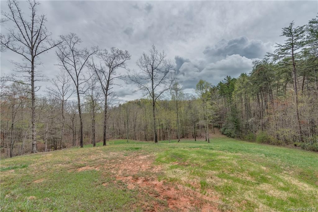 0 Sloping Meadow Mill Spring, NC 28756 - Photo 8 of 26 a backyard of a house with lots of green space