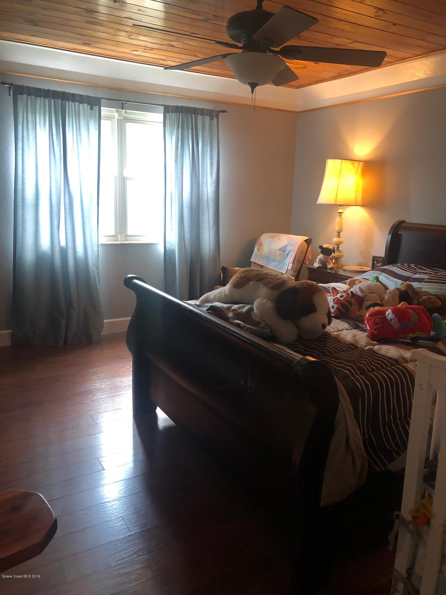 4869 Sisson Road Titusville, FL 32780 - Photo 17 of 23 Master bed