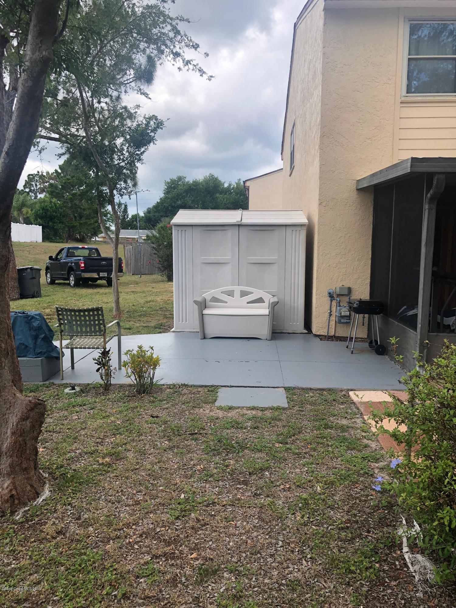 4869 Sisson Road Titusville, FL 32780 - Photo 22 of 23 Back yard and shed