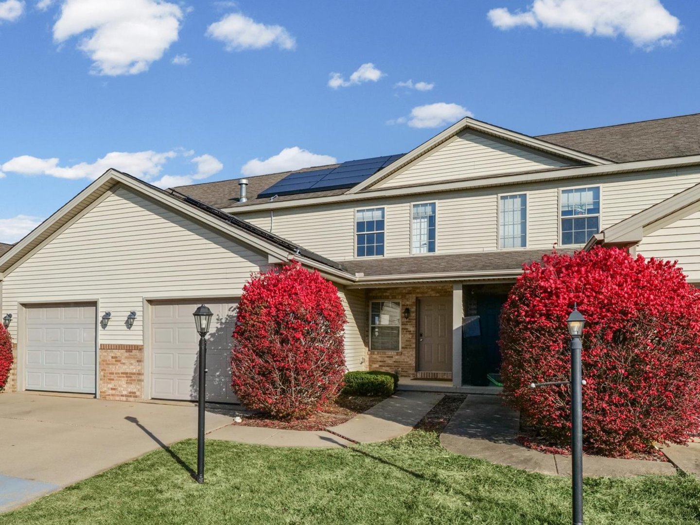 1424 Bluegrass Lane Champaign, IL 61822 - Photo 1 of 29 a front view of a house with a yard