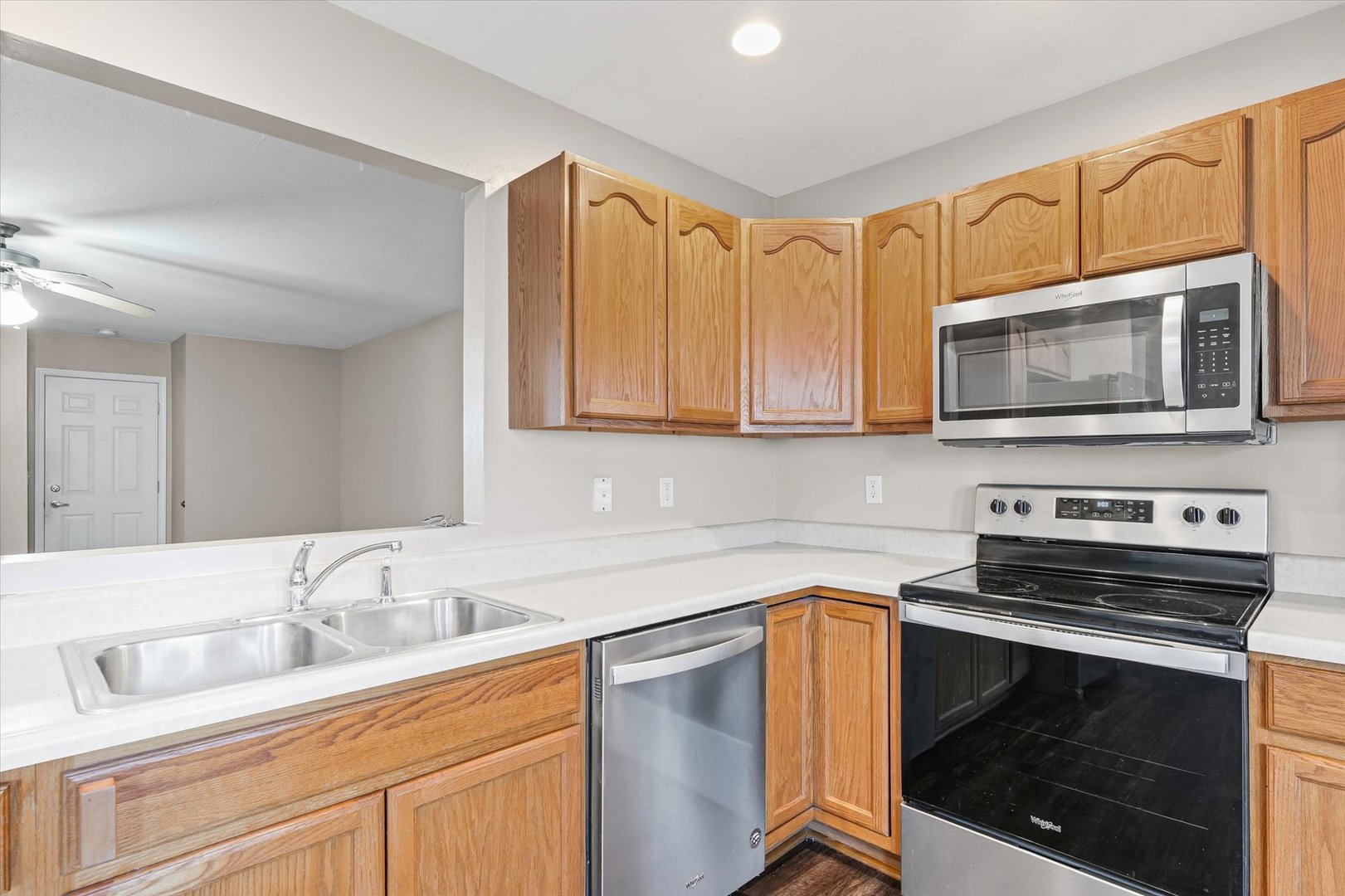 1424 Bluegrass Lane Champaign, IL 61822 - Photo 11 of 29 a kitchen with granite countertop a stove microwave sink and cabinets