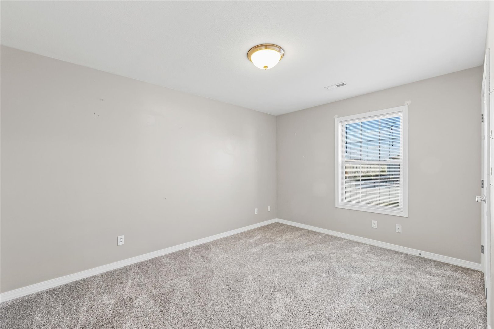 1424 Bluegrass Lane Champaign, IL 61822 - Photo 18 of 29 a view of an empty room with a window