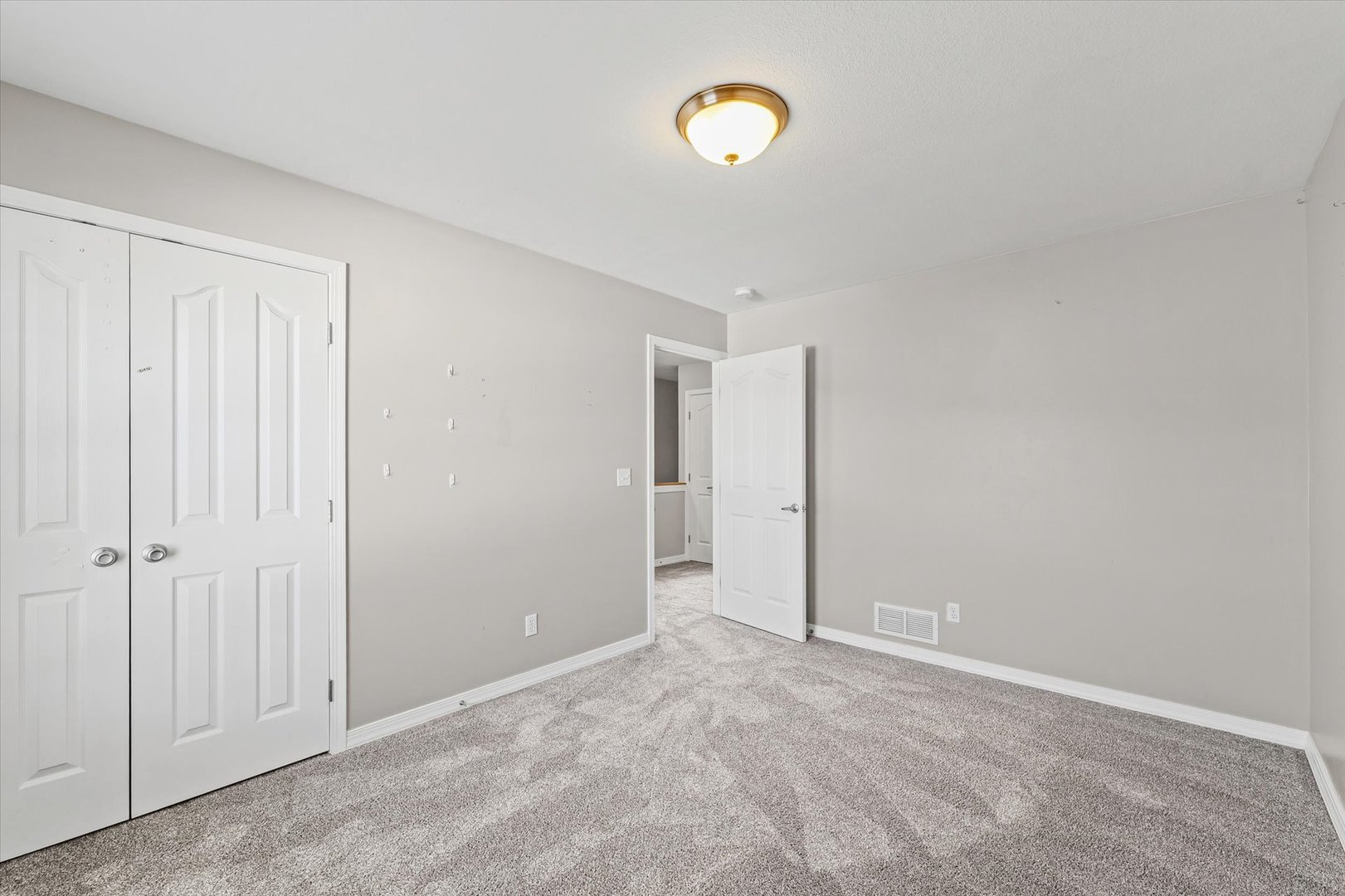 1424 Bluegrass Lane Champaign, IL 61822 - Photo 19 of 29 an empty room with windows