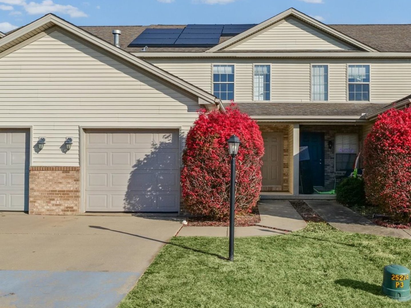1424 Bluegrass Lane Champaign, IL 61822 - Photo 2 of 29 a front view of a house with garden