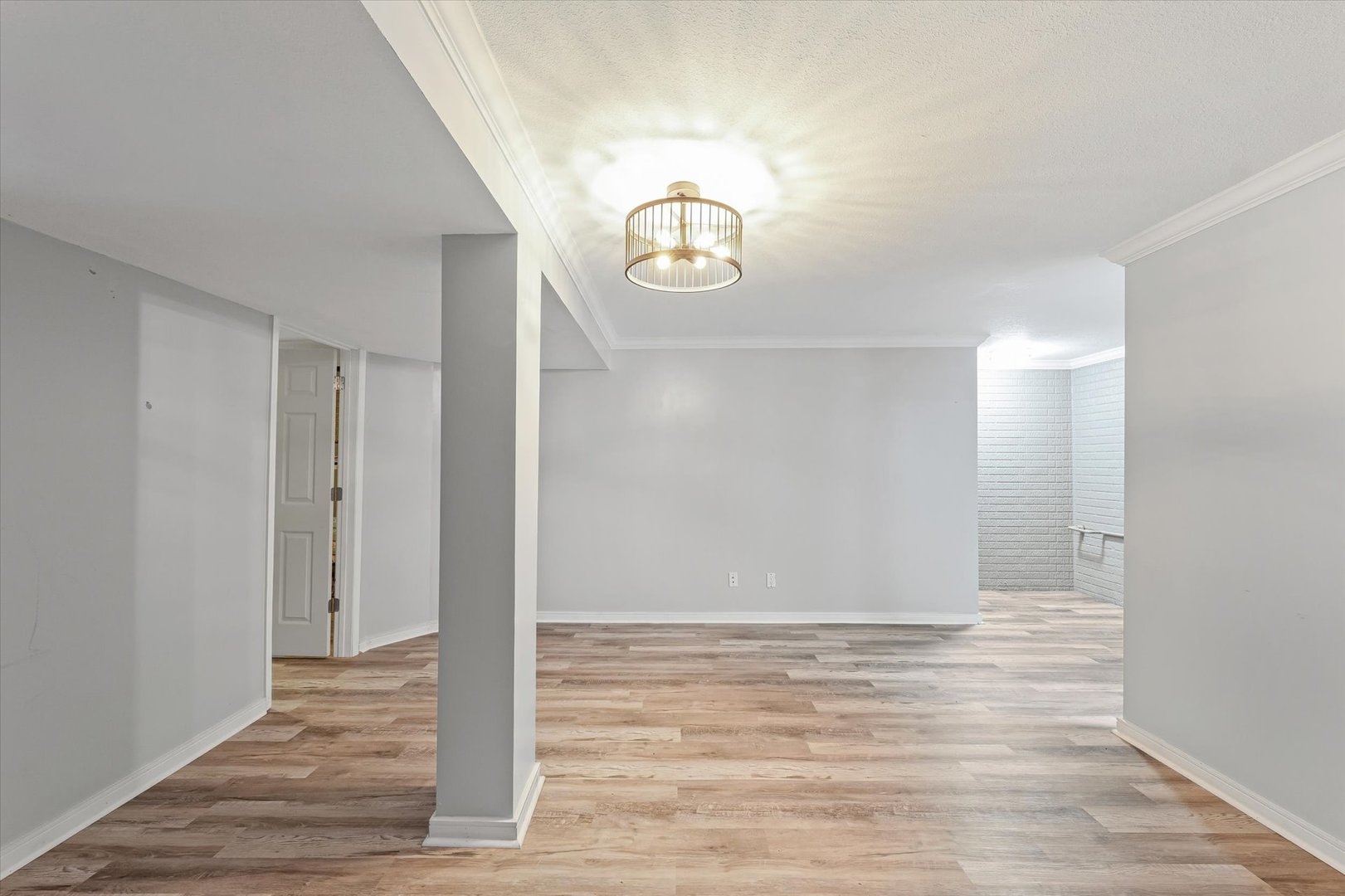 1424 Bluegrass Lane Champaign, IL 61822 - Photo 24 of 29 a view of an empty room with wooden floor and window