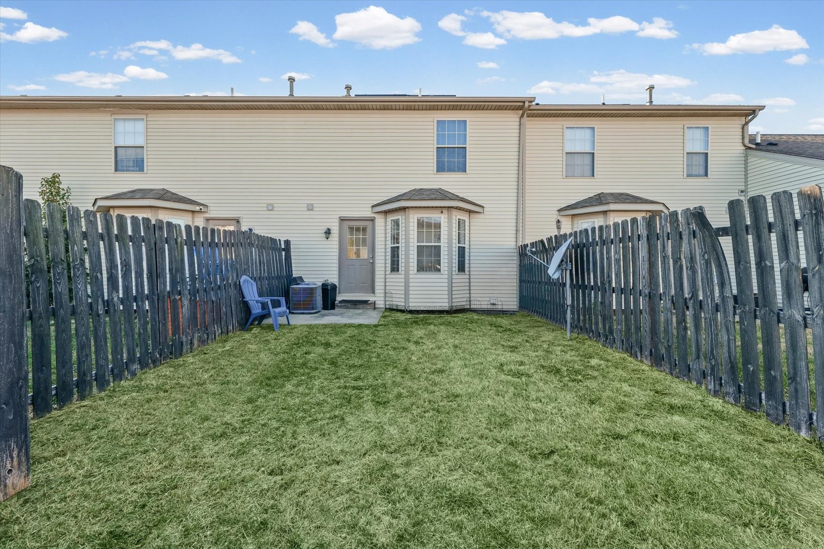 1424 Bluegrass Lane Champaign, IL 61822 - Photo 27 of 29 a view of a house with wooden fence