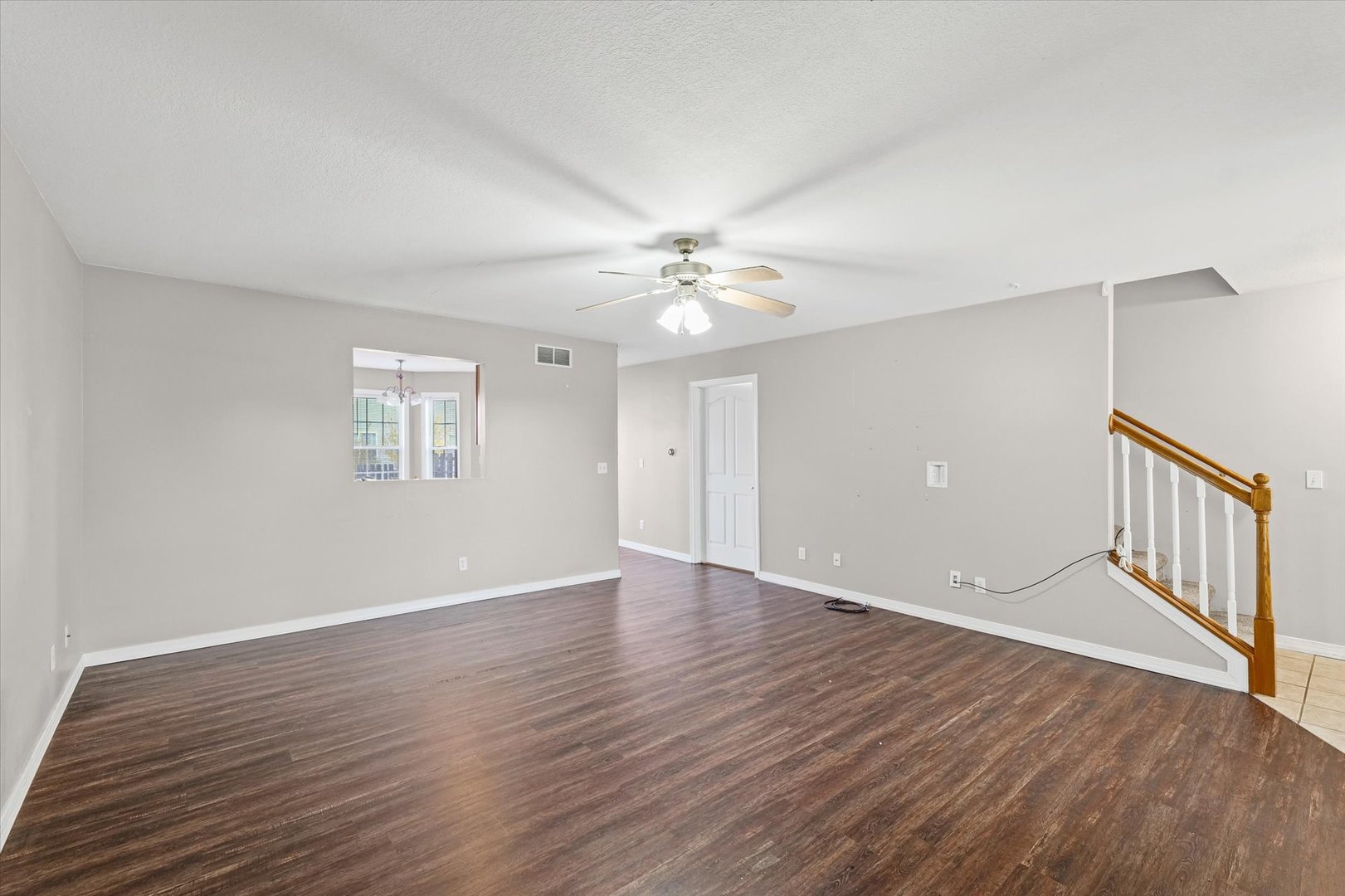 1424 Bluegrass Lane Champaign, IL 61822 - Photo 7 of 29 wooden floor in an empty room with a window