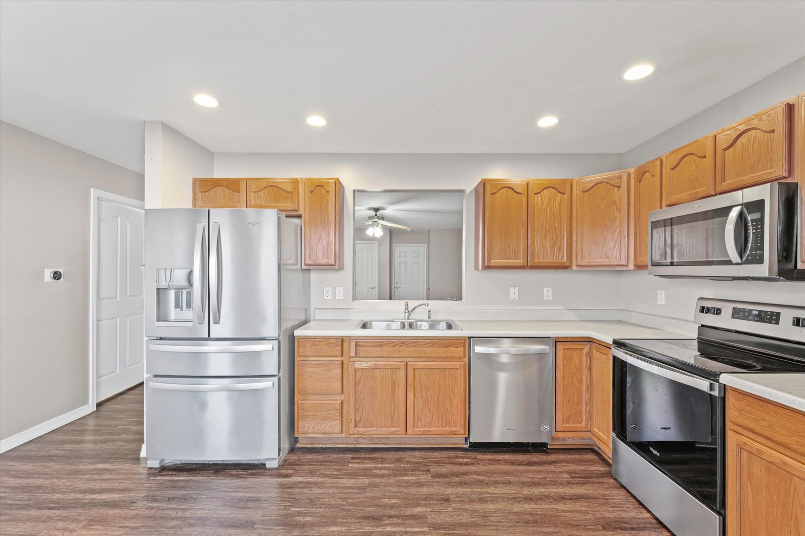 1424 Bluegrass Lane Champaign, IL 61822 - Photo 10 of 29 a kitchen with stainless steel appliances granite countertop a refrigerator a stove top oven a sink and dishwasher
