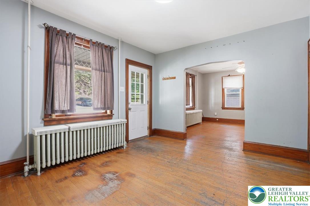 167 Main Road Lehighton, PA 18235 - Photo 6 of 41 Natural light illuminates original hardwood floors in this welcoming interior space.