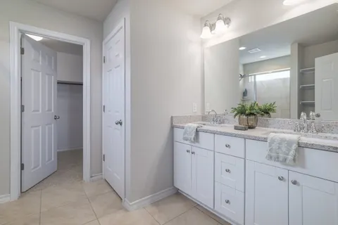 a bathroom with a glass shower door