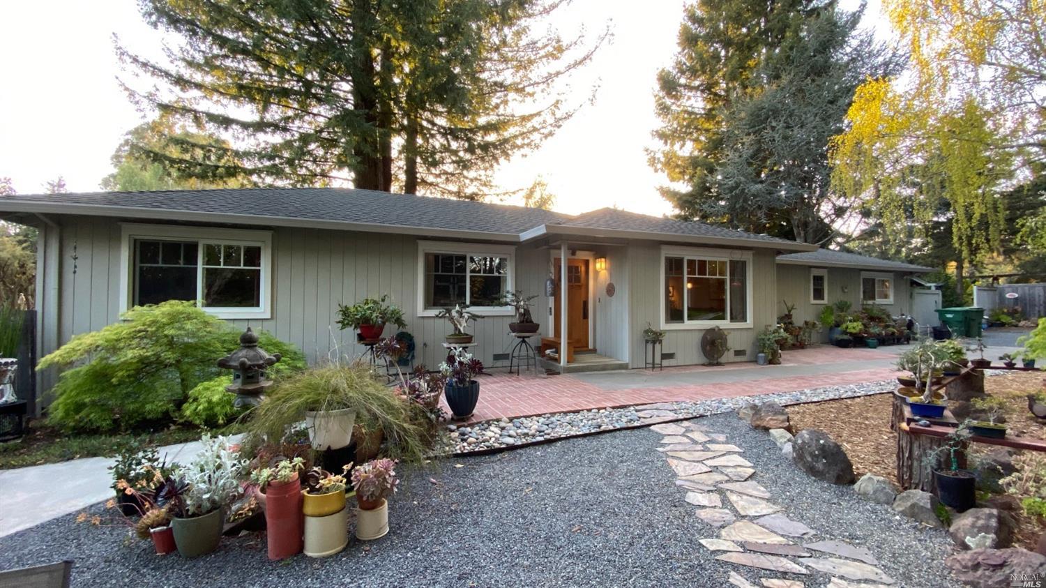 a view of a house with backyard sitting area and porch