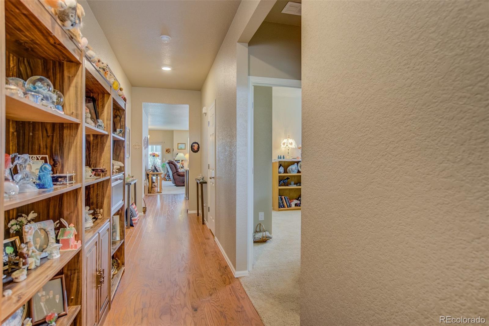 5907 Point Rider Circle Castle Rock, CO 80104 - Photo 12 of 29 a hallway with wooden floor