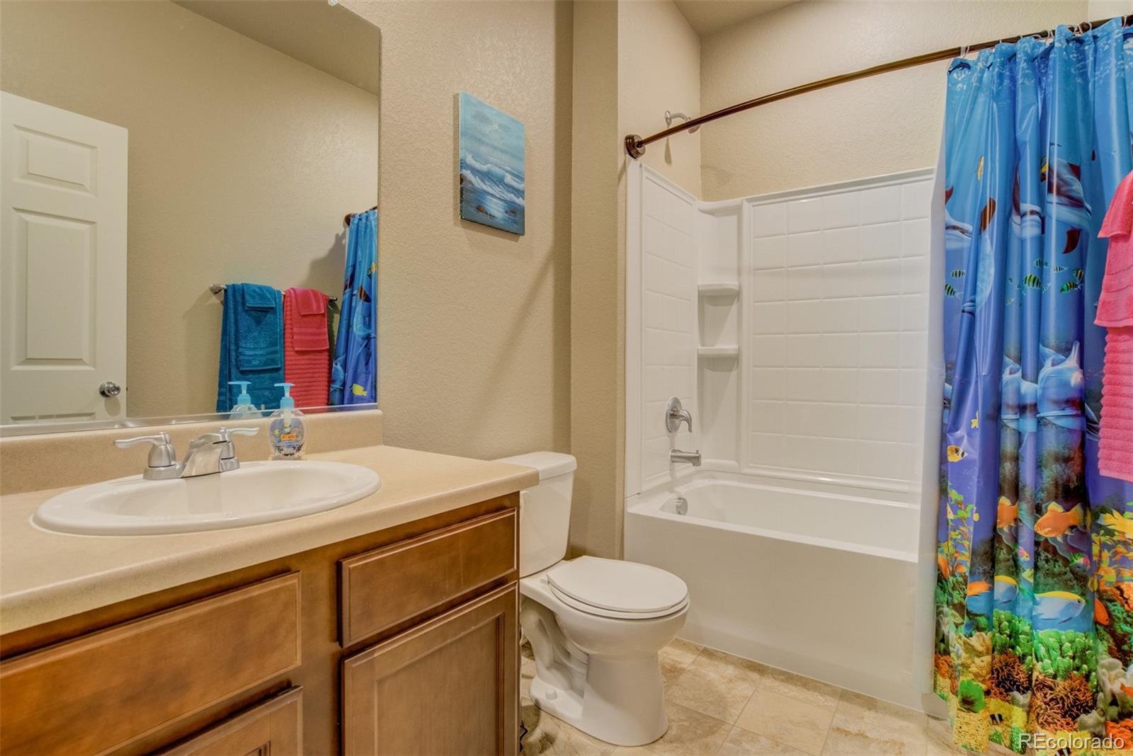 5907 Point Rider Circle Castle Rock, CO 80104 - Photo 23 of 29 a bathroom with a sink toilet and shower