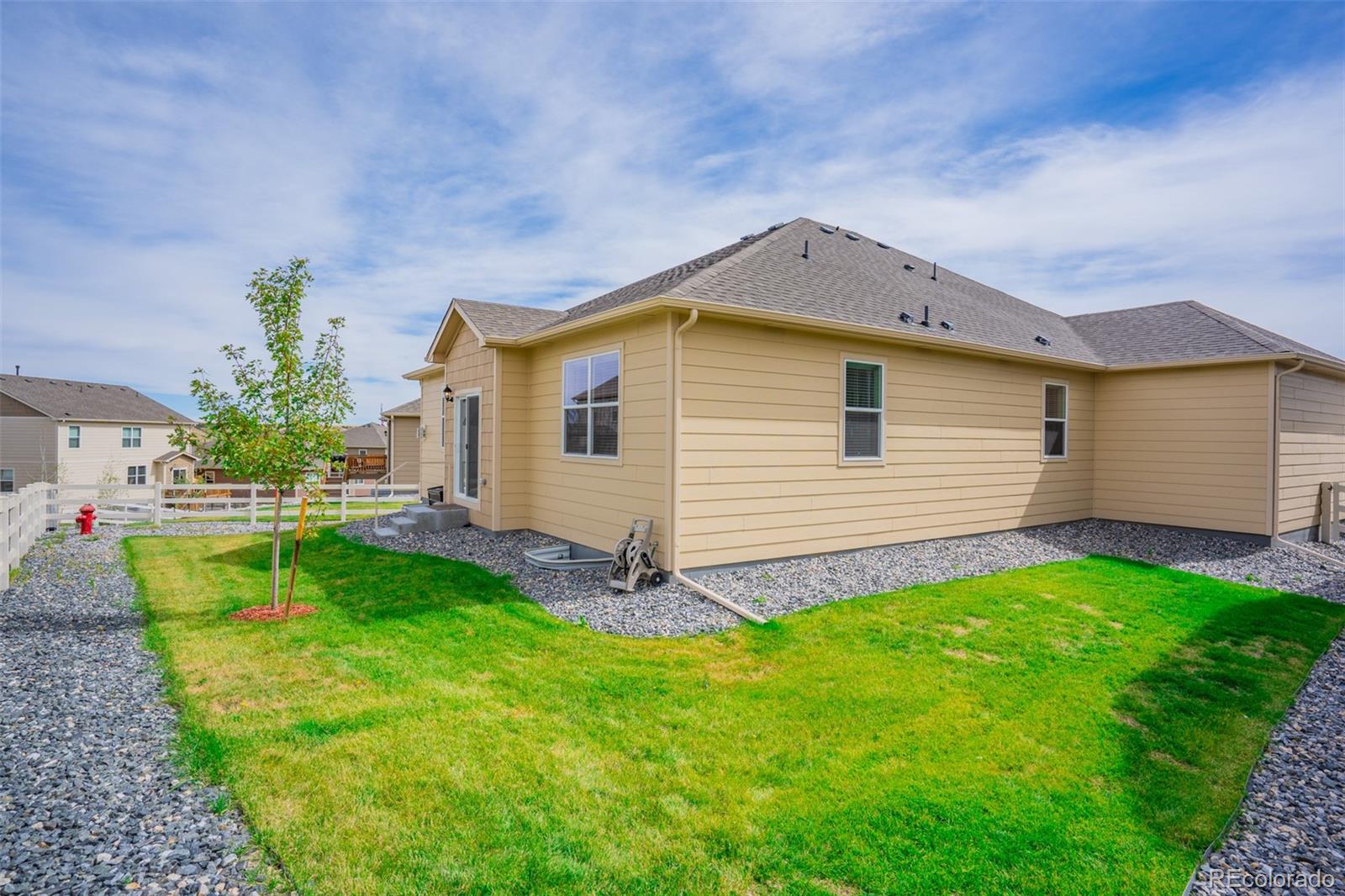 5907 Point Rider Circle Castle Rock, CO 80104 - Photo 29 of 29 a view of a house with a small yard and a garden