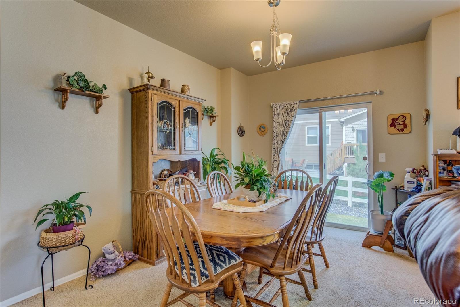 5907 Point Rider Circle Castle Rock, CO 80104 - Photo 7 of 29 a view of a dining room with furniture and chandelier