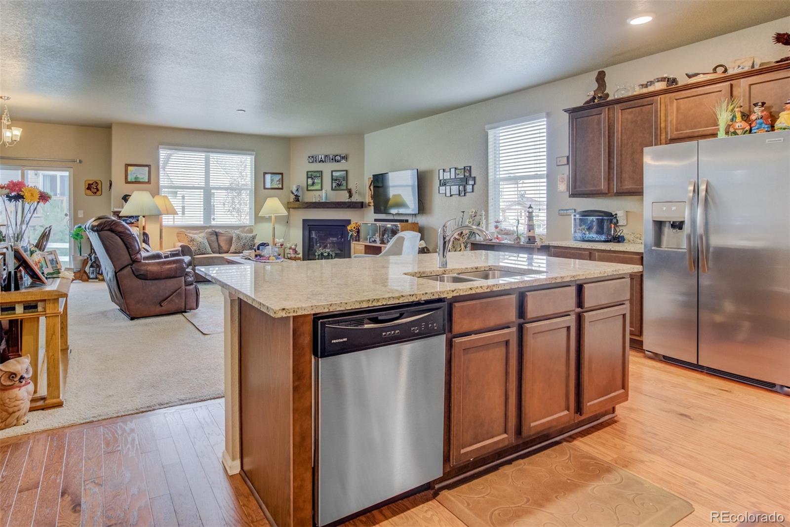 5907 Point Rider Circle Castle Rock, CO 80104 - Photo 10 of 29 a kitchen with stainless steel appliances granite countertop a sink stove and refrigerator